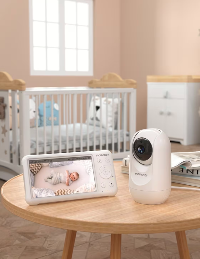 Baby monitor and baby in cot