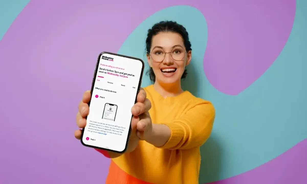 A woman showing a shopping app on her phone