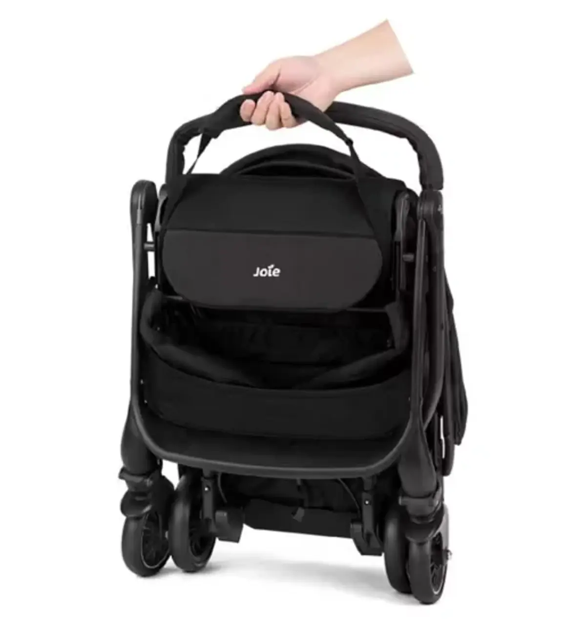The folded Joie stroller carried one-handed