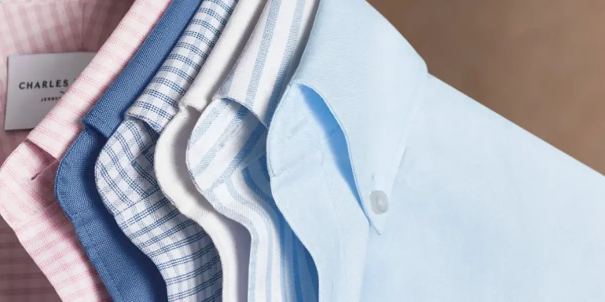 Folded Charles Tyrwhitt shirts in shades of blue