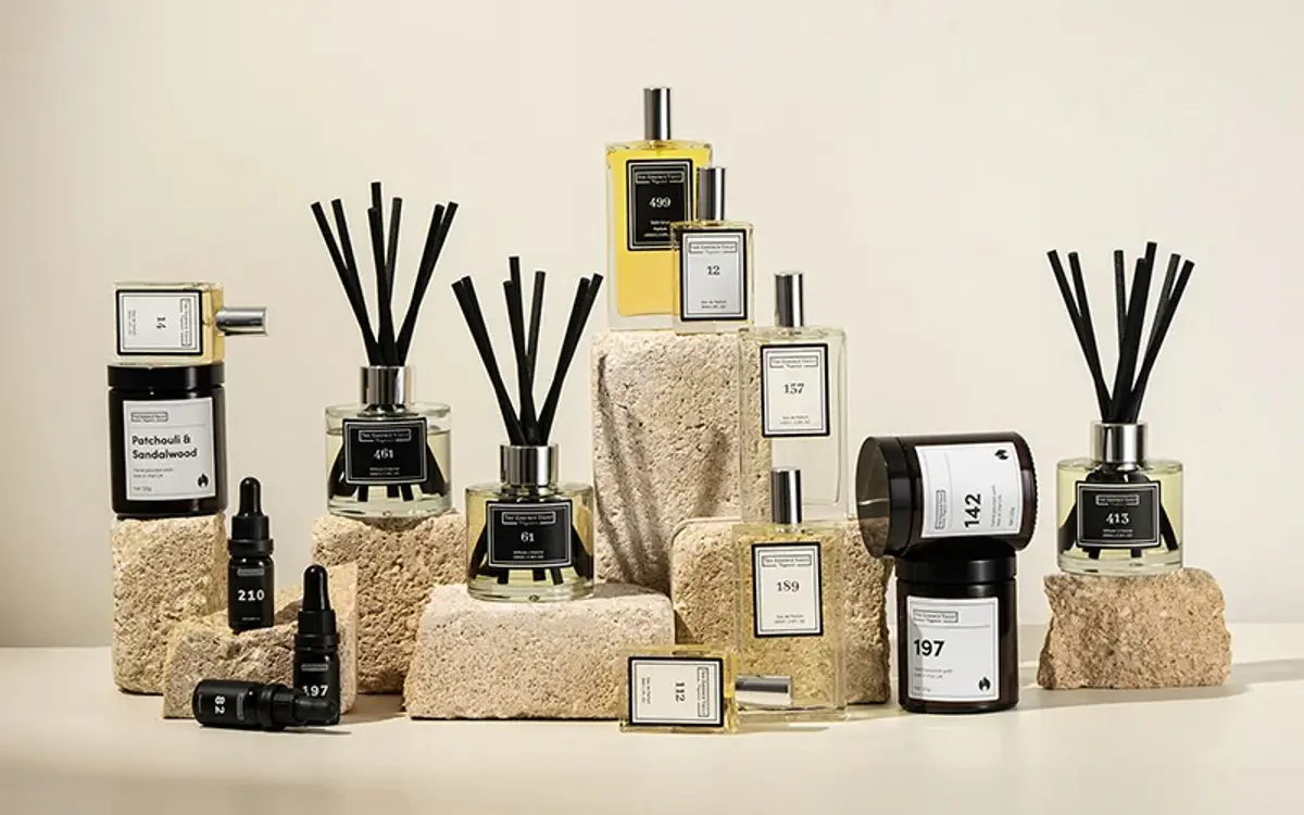 Home fragrance diffusers arranged on stone