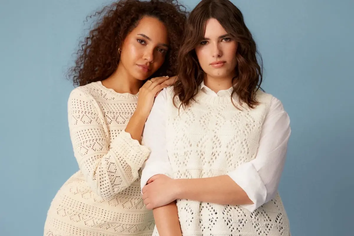 Two women in white knitted summer dresses